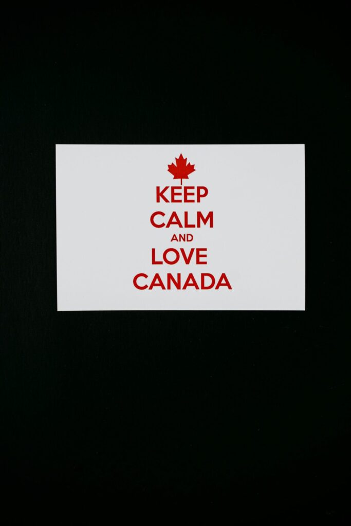Minimalist card with a black background featuring the text 'Keep Calm and Love Canada'.