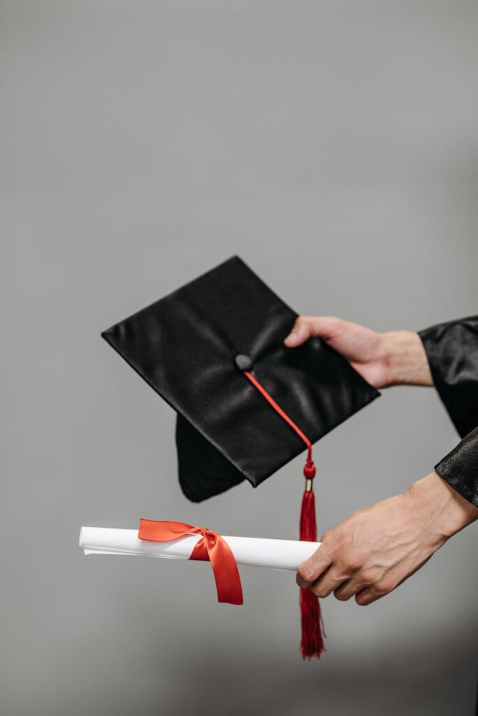 A close-up of a graduation cap and rolled diploma symbolizing achievement and success.