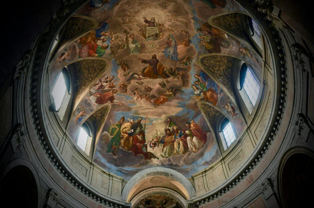 Captivating frescoe artwork on a dome interior in a Roman cathedral, Italy.